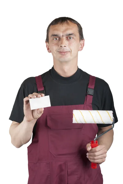 Painting contractor in overalls with paint roller — Stock Photo, Image