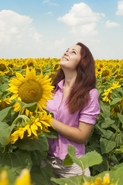 Girl in sunflowers. — Stock Photo, Image