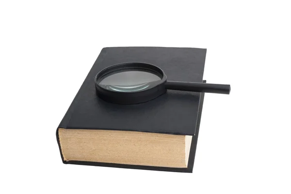 Book and magnifying glass — Stock Photo, Image