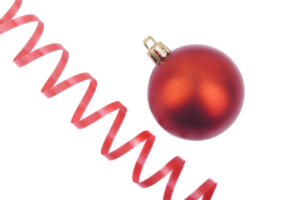 Red Christmas ball and serpentine. — Stock Photo, Image