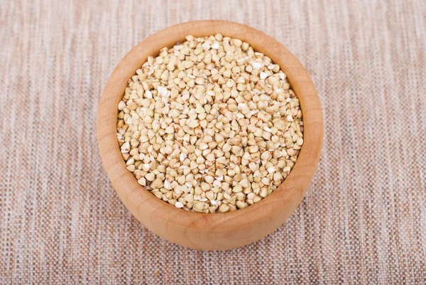 Plate of buckwheat on the tablecloth. — Stock Photo, Image