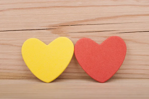 Two hearts on a wooden background. — Stock Photo, Image