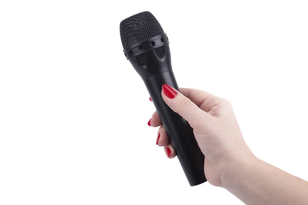 Main féminine avec un microphone . — Photo