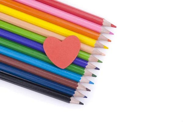 Paper heart on colored pencils. — Stock Photo, Image