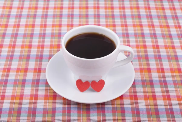 Cup of coffee and two hearts. — Stock Photo, Image