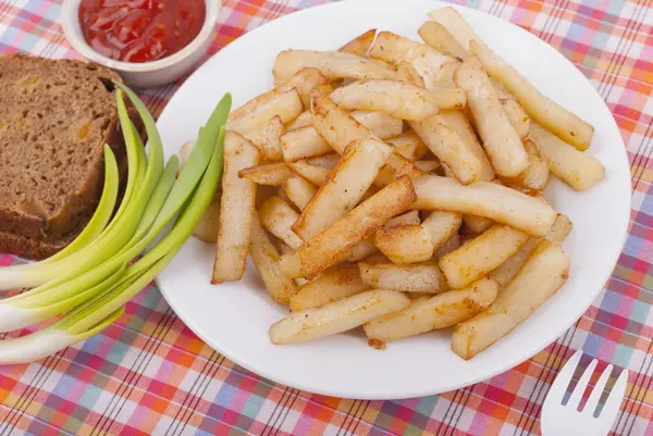 Chips in a bowl on the table. — Stock Photo, Image