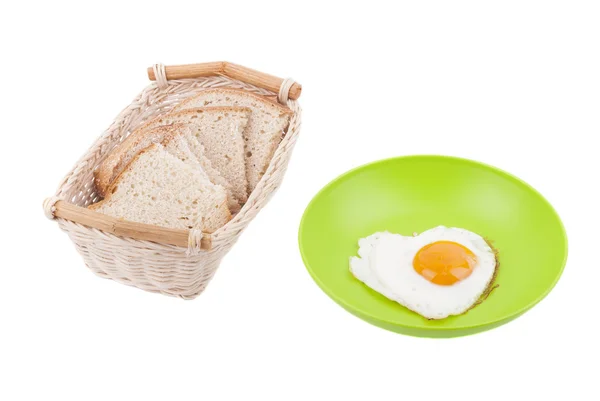 Scrambled in a heart shape on a plate. — Stock Photo, Image