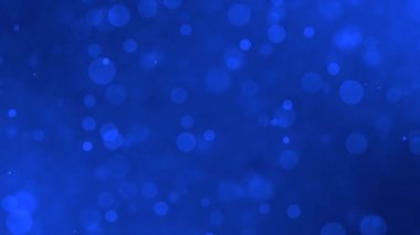 Bulanık mavi dairelerin soyut hareketi. Bokeh etkisi arkaplanı.