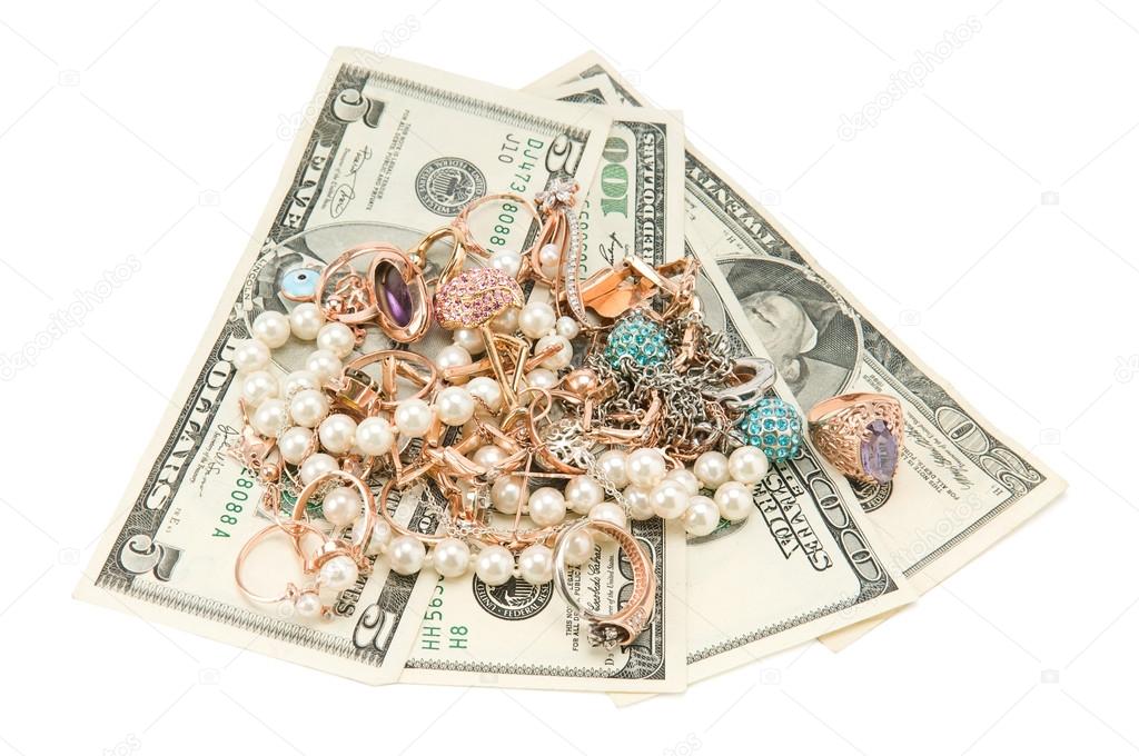Gold jewelry and dollars