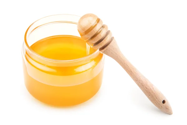 Pot with honey and drizzler — Stock Photo, Image