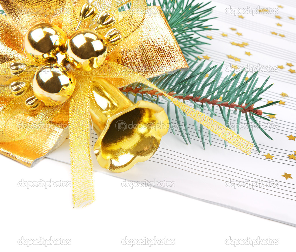 Christmas decorations and music sheet isolated on white background
