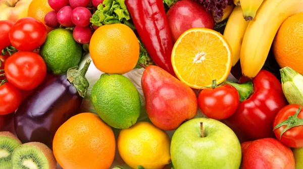 Bright background of ripe fruits and vegetables — Stock Photo, Image