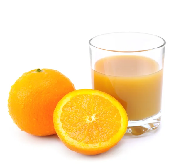 Laranjas e suco de laranja — Fotografia de Stock