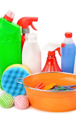 Collection of various household cleaning products isolated on a white background. Vertical photo.