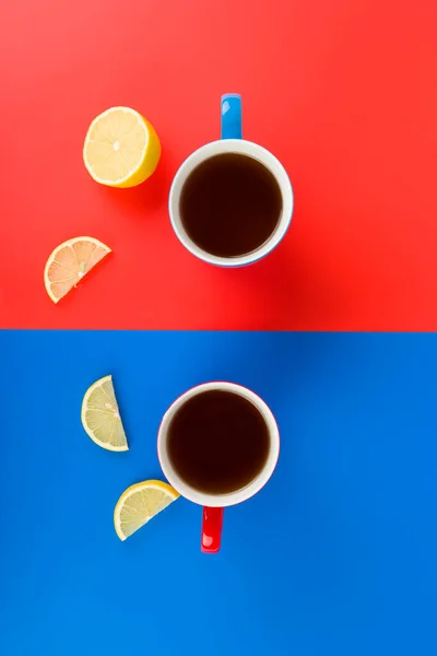 Tea cups in red and blue on a red and blue background. Place for your text.Valentines day concept