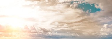 Beautiful sky with bright sunset (sunrise) and light clouds. Wide photo.