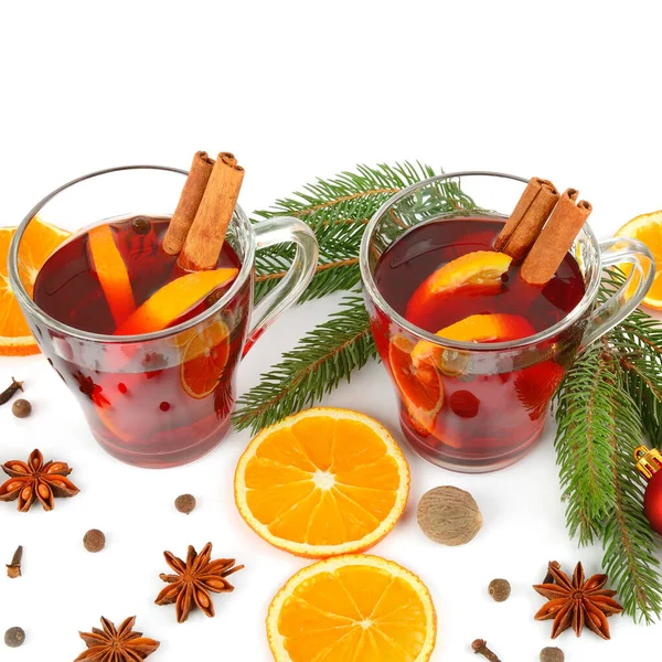 Mulled wine and Christmas decor on white background.