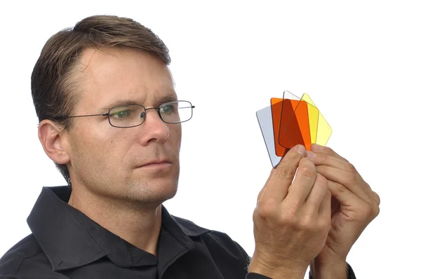 Photographer inspecting filters — Stock Photo, Image