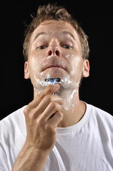 Man shaving chin — Stock Photo, Image