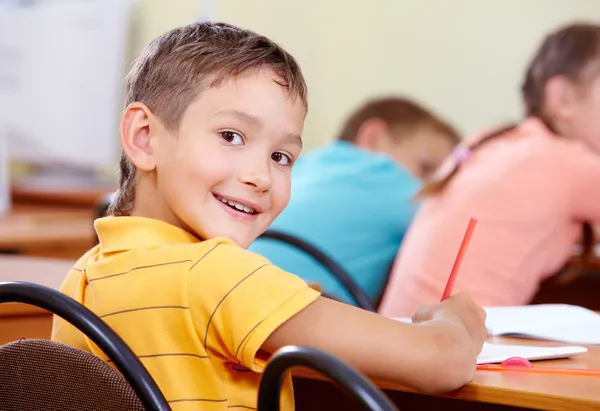 Pupil at workplace Stock Photo