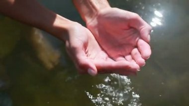 Hands in water