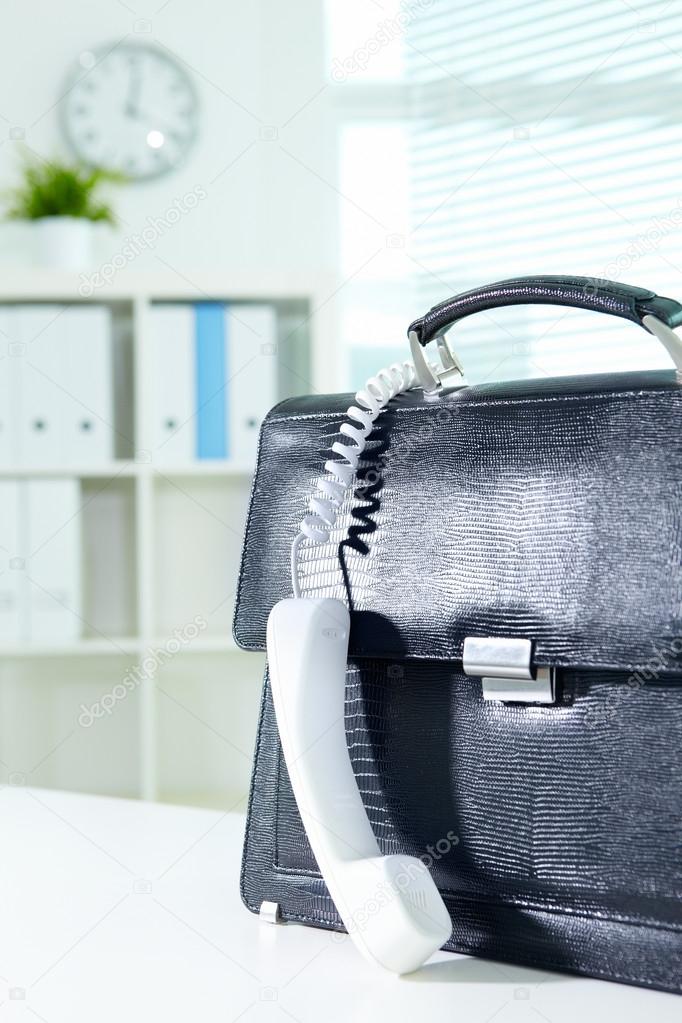 Briefcase and receiver Stock Photo by ©pressmaster 19208267