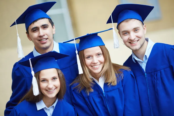 Friends in graduation gowns — Stock Photo, Image
