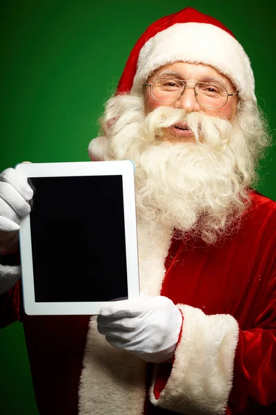 Santa com touchpad — Fotografia de Stock
