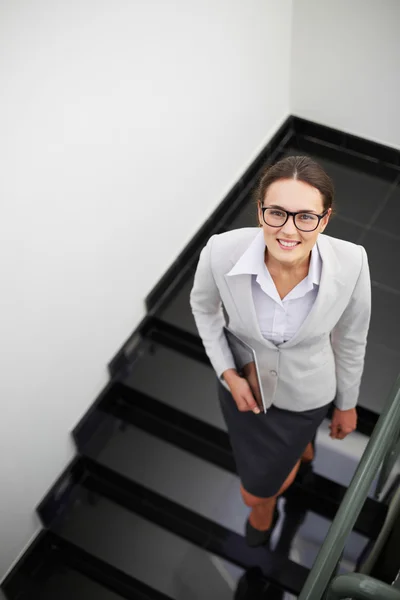 Woman on staircase — Stock Photo, Image