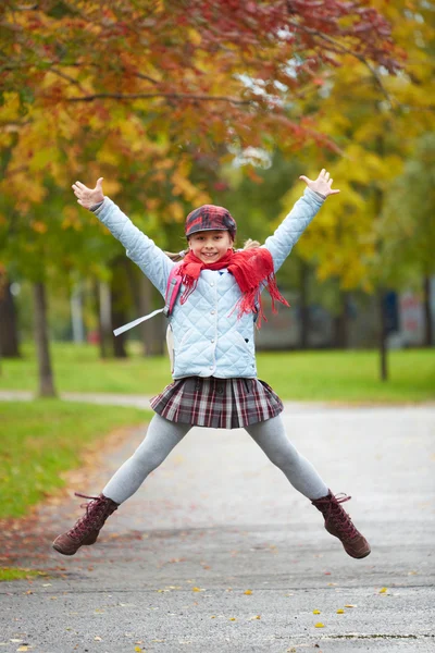 Schoolgirl jumping — Stock Photo, Image