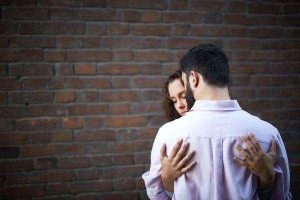 Man being embraced by his girlfriend — Stock Photo, Image