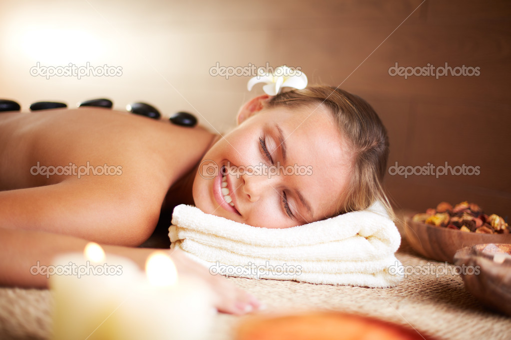 Young female enjoying spa procedure