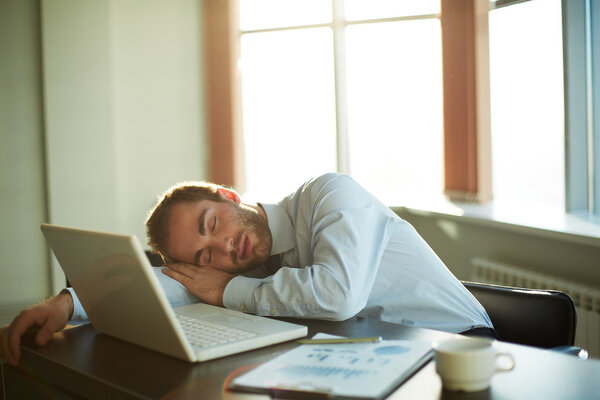 Sleeping businessman at work