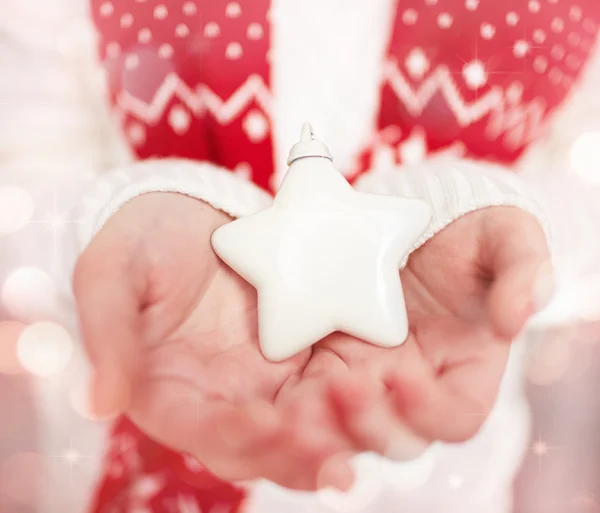 Christmas star in hands — Stock Photo, Image