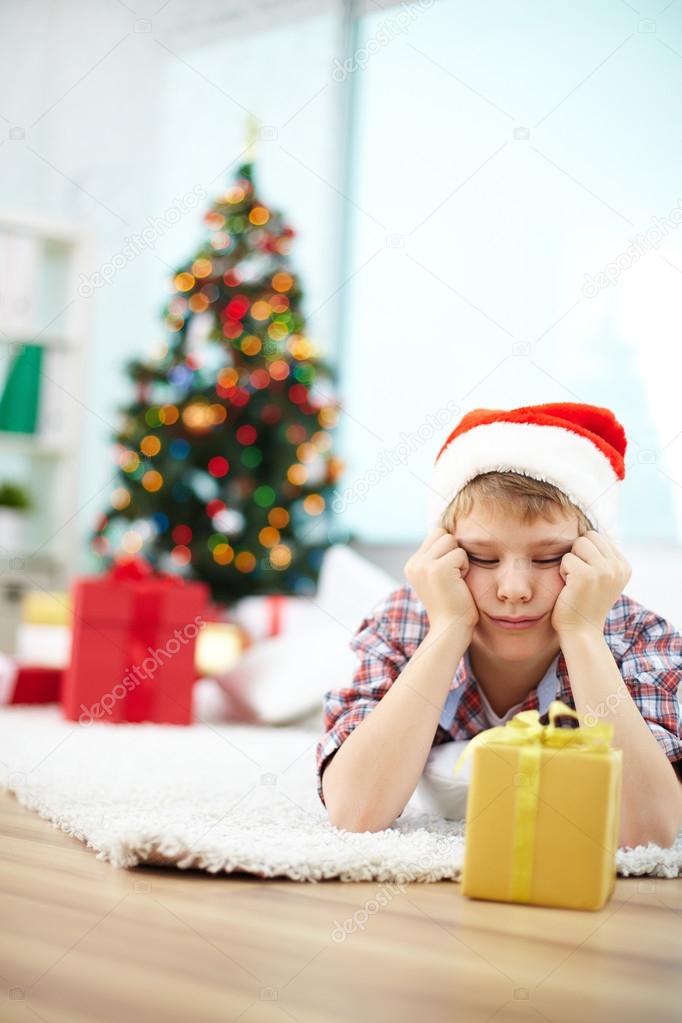 Boy looking at giftbox
