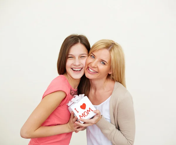 Girl and her mom with small present