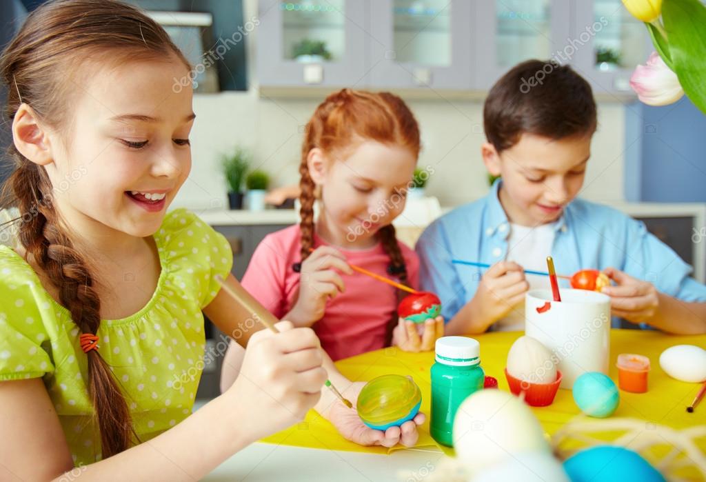 Children painting eggs — Stock Photo © pressmaster 42526287