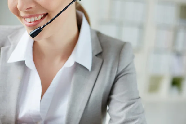 Smile of female operator — Stock Photo, Image