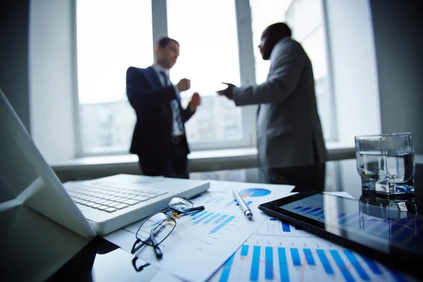 Laptop, touchpad and financial documents — Stock Photo, Image