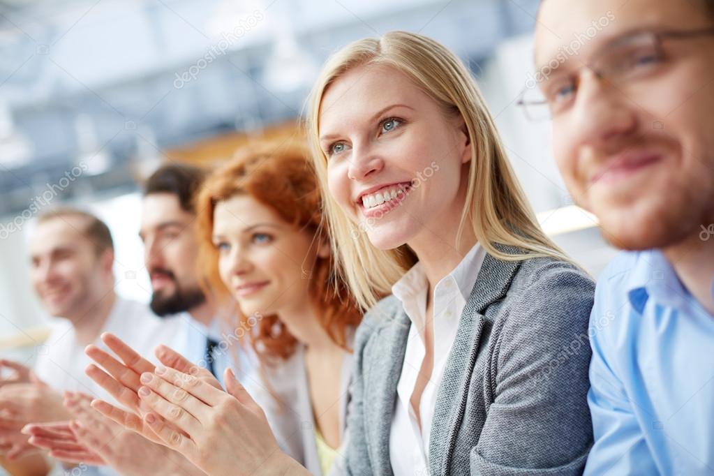 Business leader clapping at the seminar