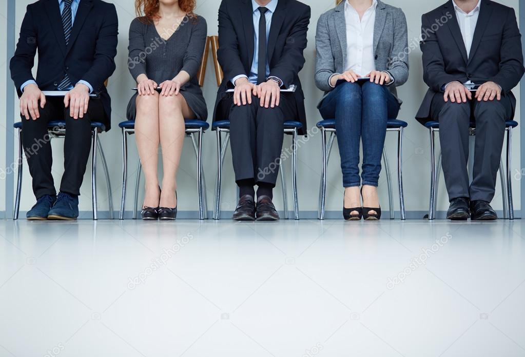 Business people sitting on chairs