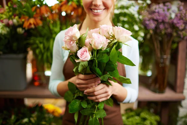 Female holding bunch of roses — Stock Photo, Image