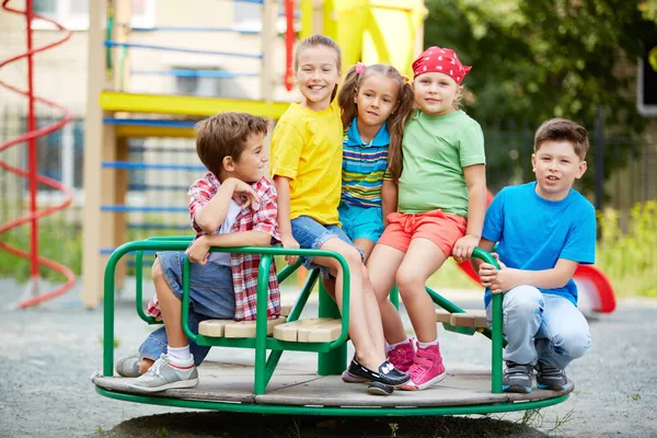 Friends on carousel — Stock Photo, Image