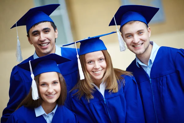 Friends in graduation gowns — Stock Photo, Image