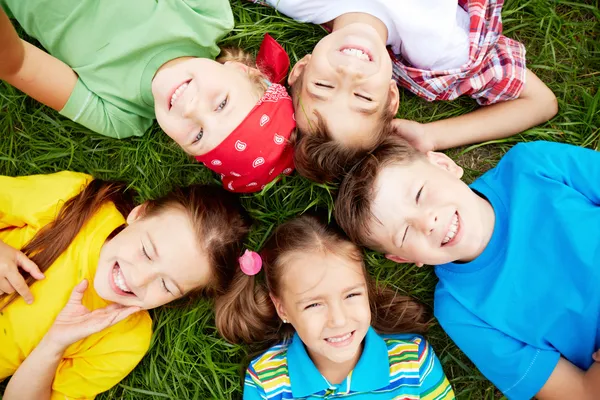 Children on grass Royalty Free Stock Images