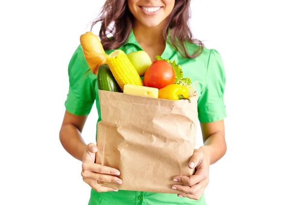 Menina com pacote cheio de frutas e legumes — Fotografia de Stock