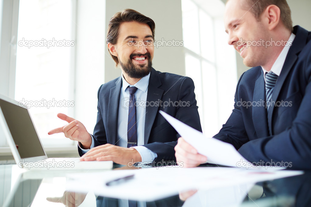 Businessman pointing at laptop screen