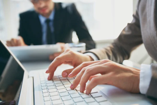 Hands pressing laptop buttons — Stock Photo, Image