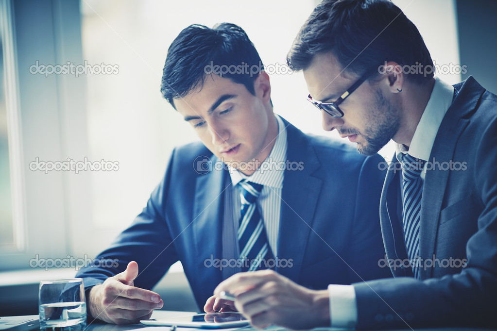 Businessmen using touchpad