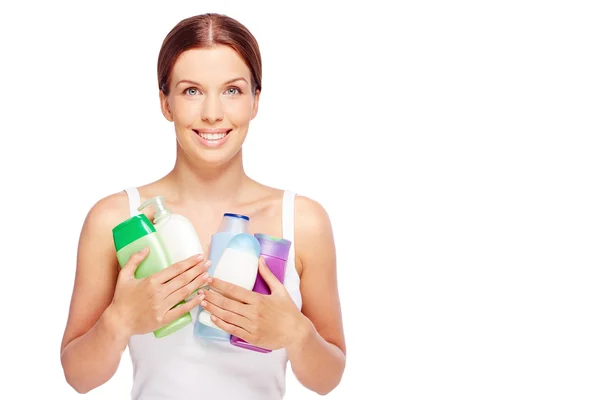Woman with body care cosmetics — Stock Photo, Image